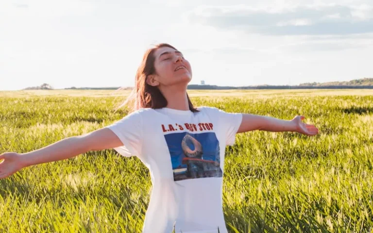 woman standing in green field